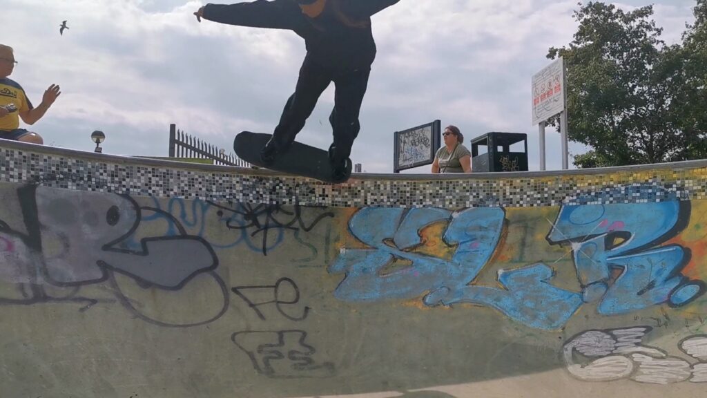 A professional portrait of Leoni, the safeguarding officer, highlighting her role in ensuring the safety and well-being of all participants in the skateboarding program. Ideal for staff profiles, safety pages, and promotional content emphasizing secure and responsible coaching environments.