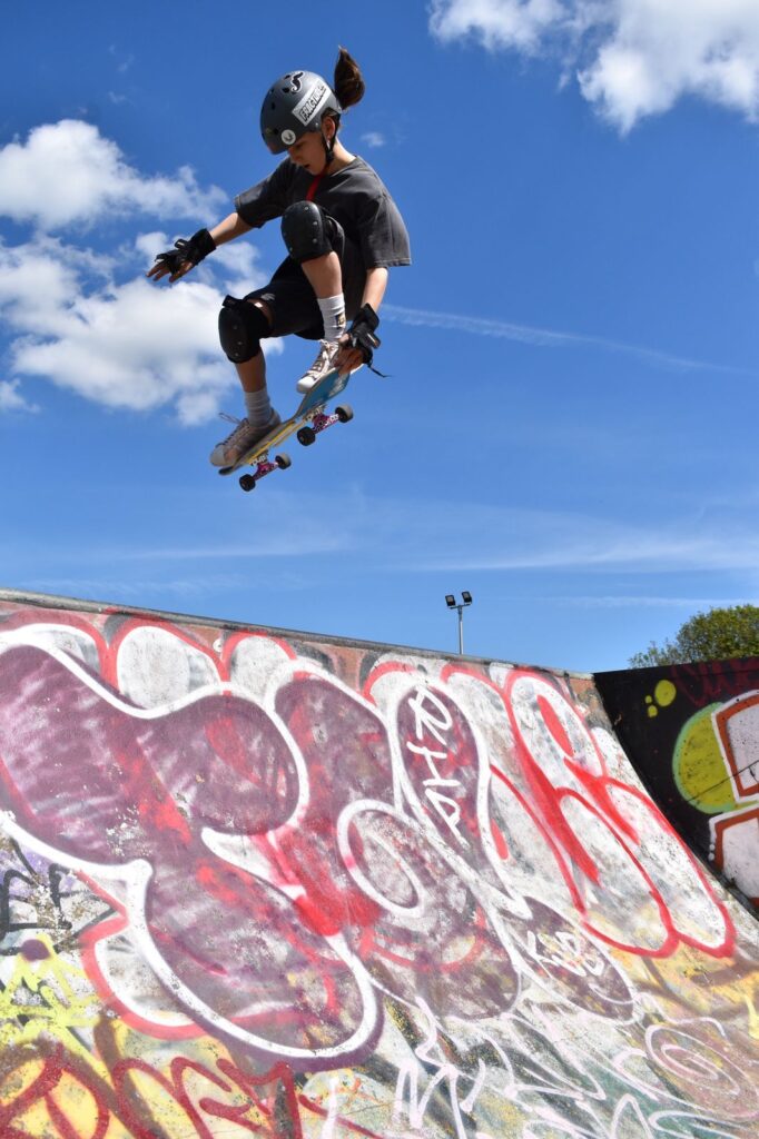 Drew, one of our regulars, pops a massive tail grab air out of the jump box ramp at Jackson's field skatepark. Drew has been skateboarding a few years now and is a testament to hard work