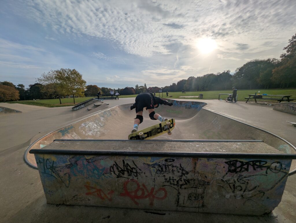 Skateboarder performing a 5-0 grind on the extension at Cozenton Skatepark